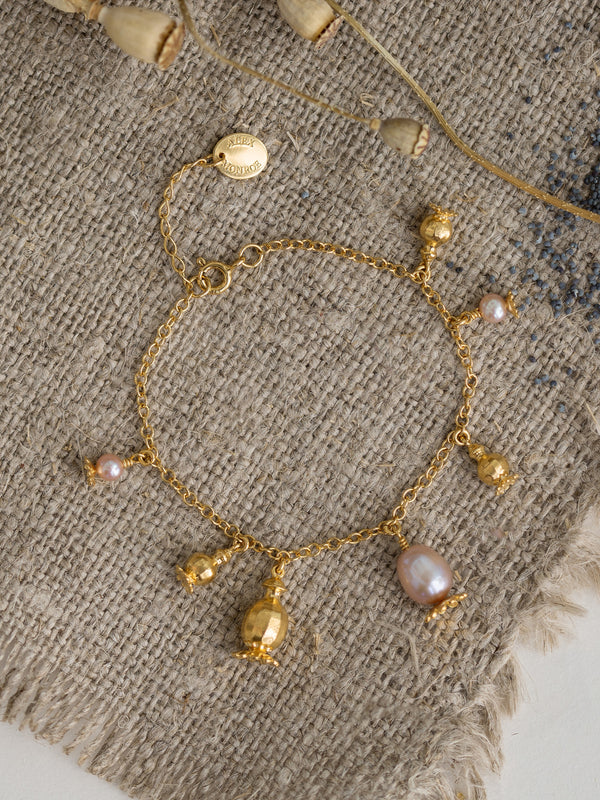 Scattered Poppy Head Charm Bracelet with Pink Pearls