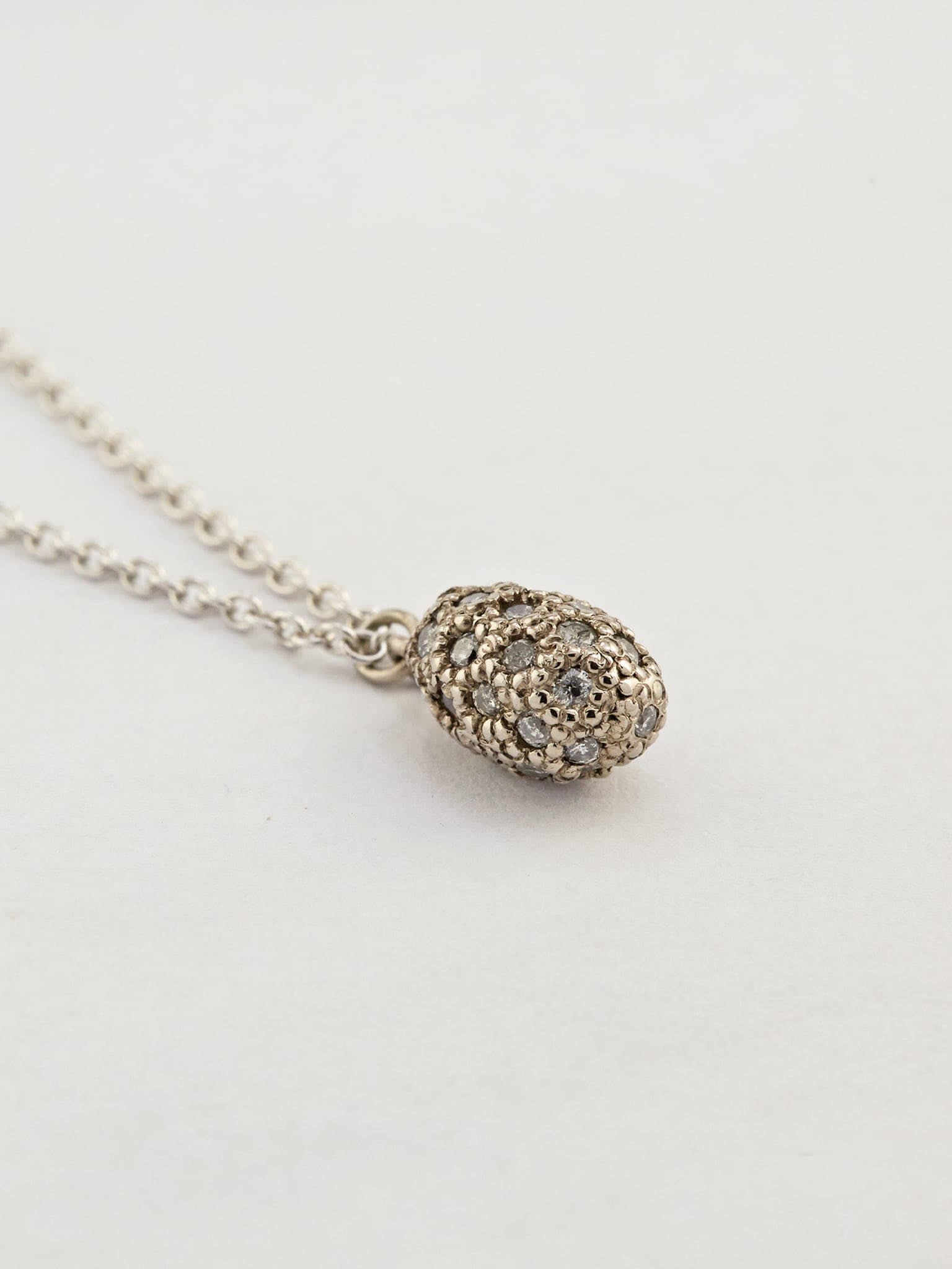 Prehistoric Egg Necklace with Grey Diamonds - image 2 | 18ct white gold