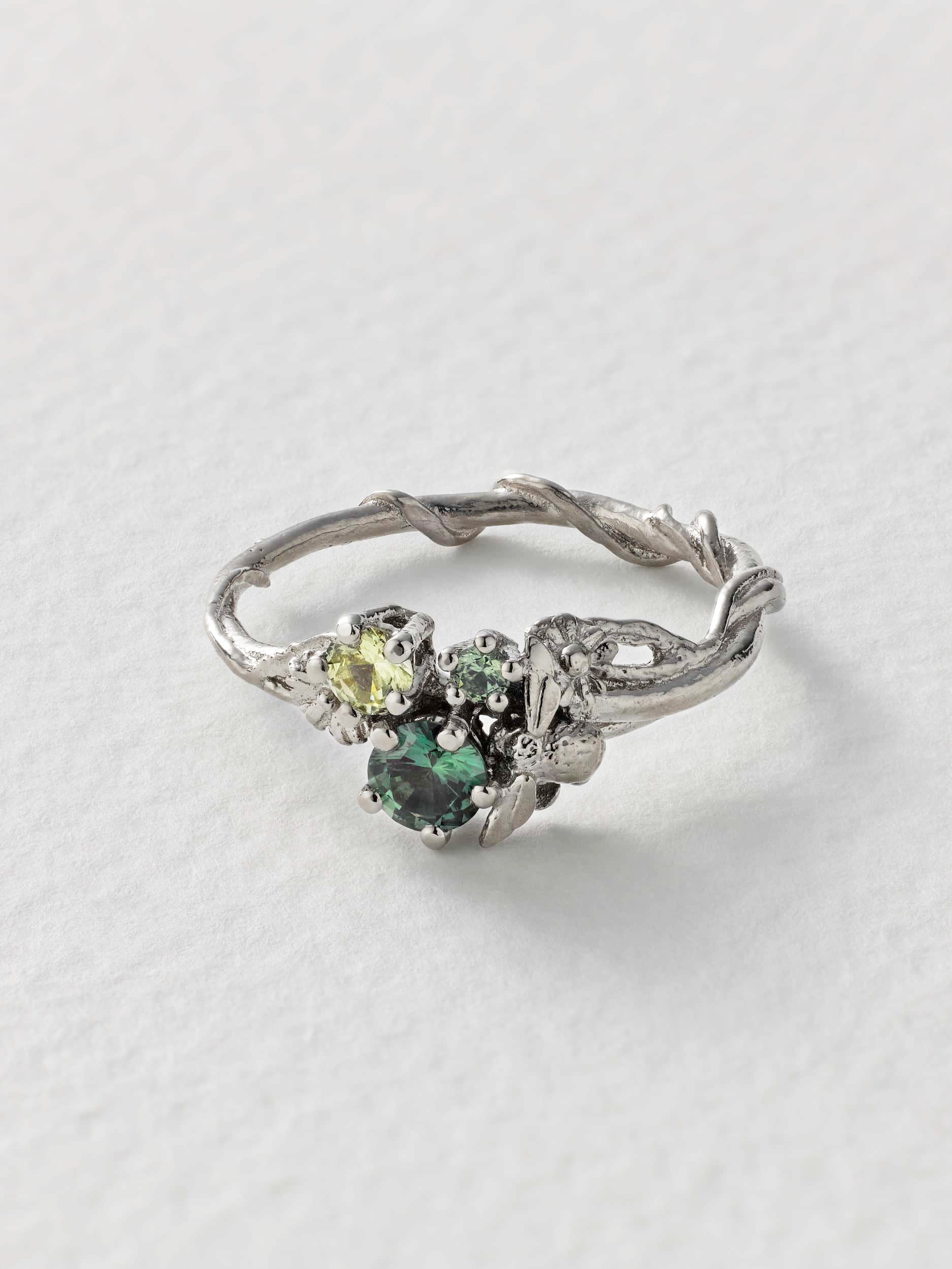Beekeeper Apple, Green and Yellow Magacascan Sapphire Trilogy Ring - image 2 | 18ct white gold