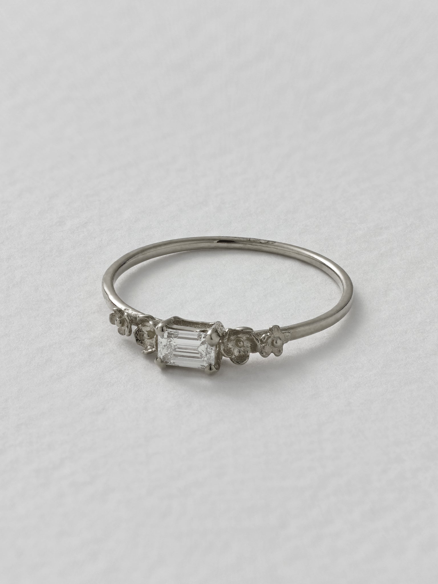 Fine Ring with 0.25ct Emerald Cut Diamond & Floral Details - image 6 | 18ct white gold