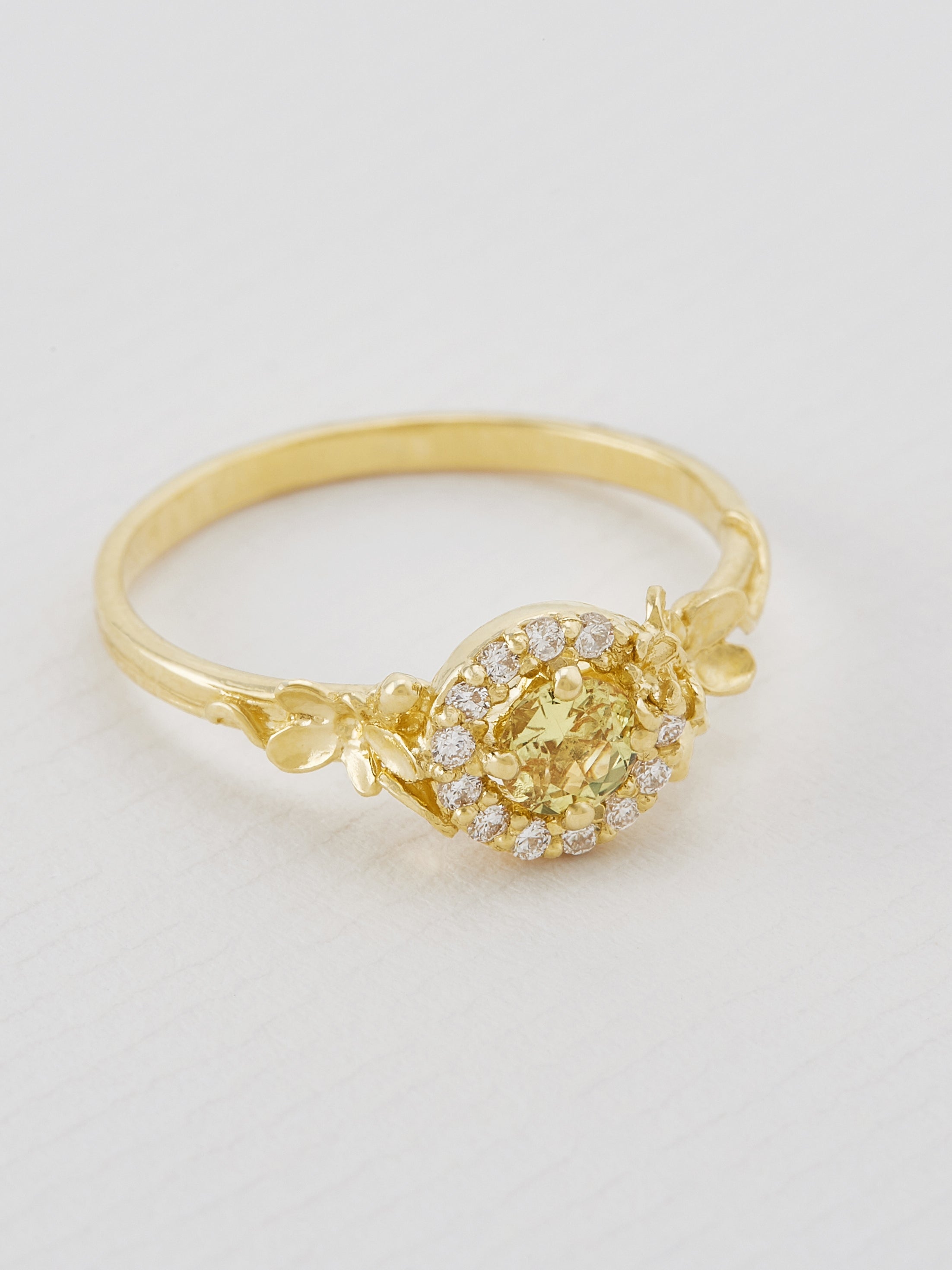 Small Spring Halo Ring with 0.33ct Citrus Yellow Sapphire and Diamonds - image 2 | 18ct yellow gold
