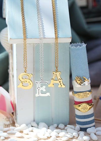 'Sea' spelt out with Alex Monroes new alphabet necklaces